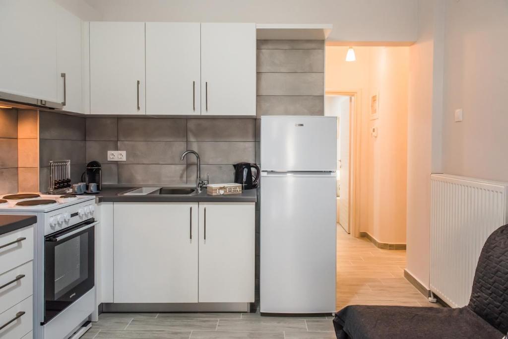 Kuchyňa alebo kuchynka v ubytovaní Freesia #colony_Urban_apartment