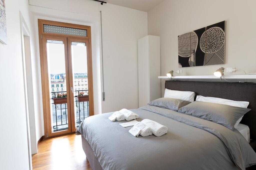 A bed or beds in a room at Florestine Napoli