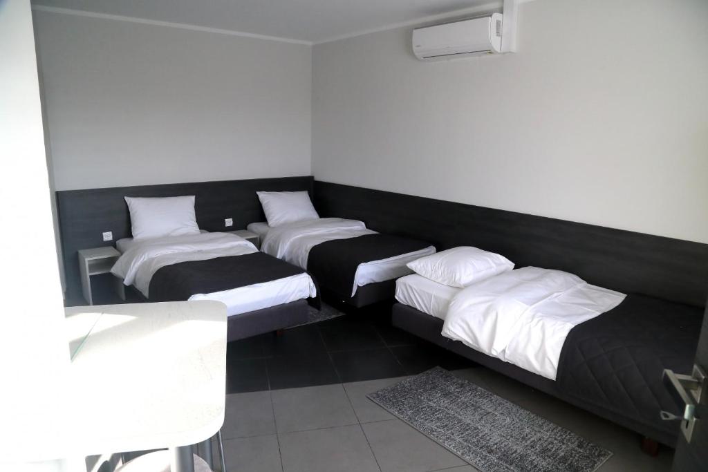 Postel nebo postele na pokoji v ubytování Motel Dymek