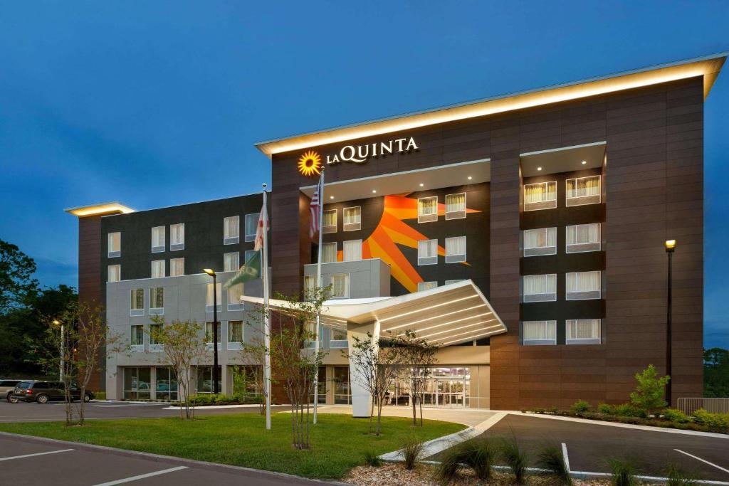 a building with a jumeirah sign on it at La Quinta by Wyndham Gainesville in Gainesville