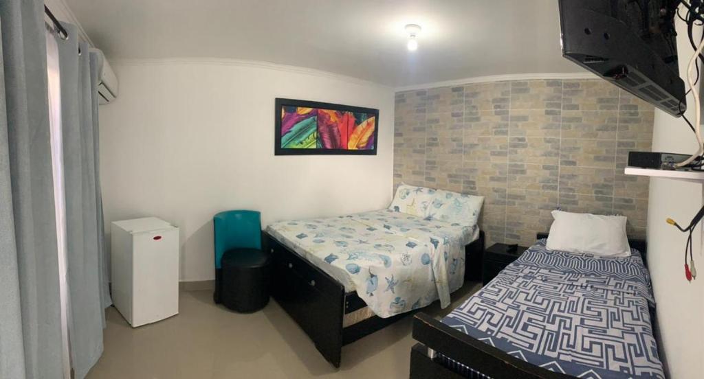 Voodi või voodid majutusasutuse Posada Cocos Place toas