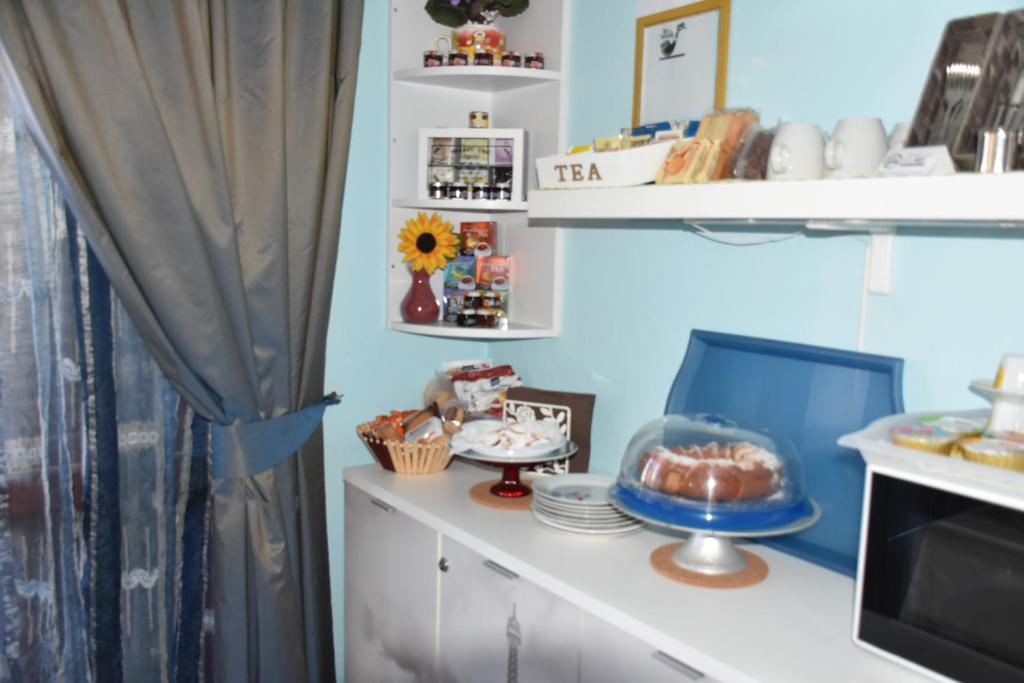 Kuchyň nebo kuchyňský kout v ubytování B&B Il Girasole
