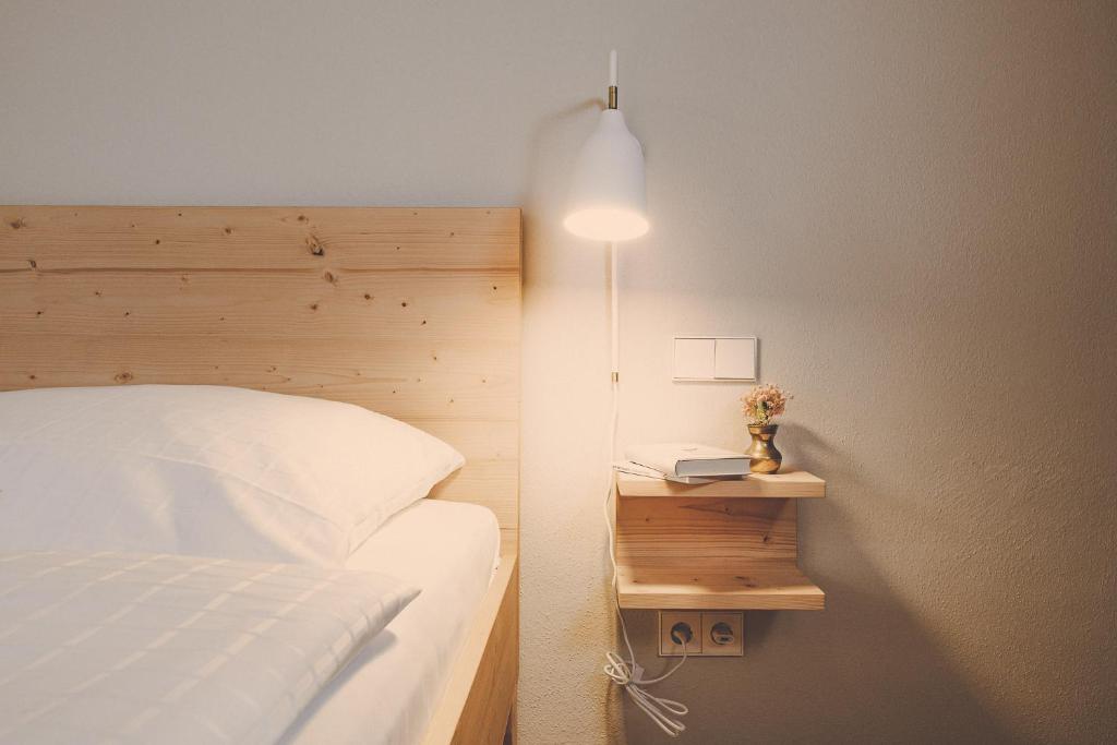 Postel nebo postele na pokoji v ubytování Der Lederer Hof - Boutique Apartments