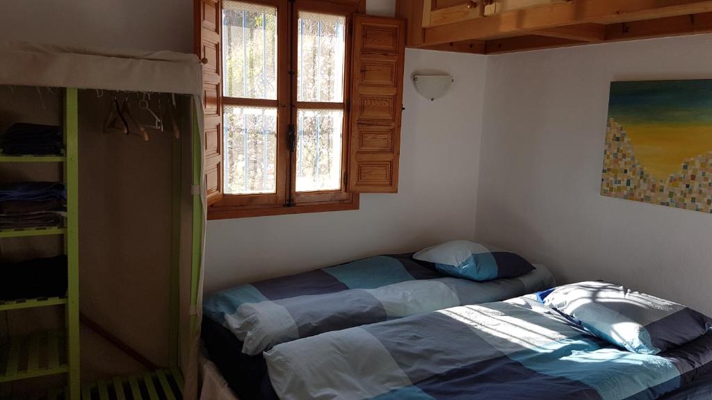 Postel nebo postele na pokoji v ubytování Casa Feliz