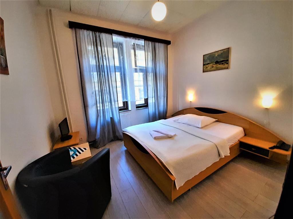 Łóżko lub łóżka w pokoju w obiekcie Hotel Olga