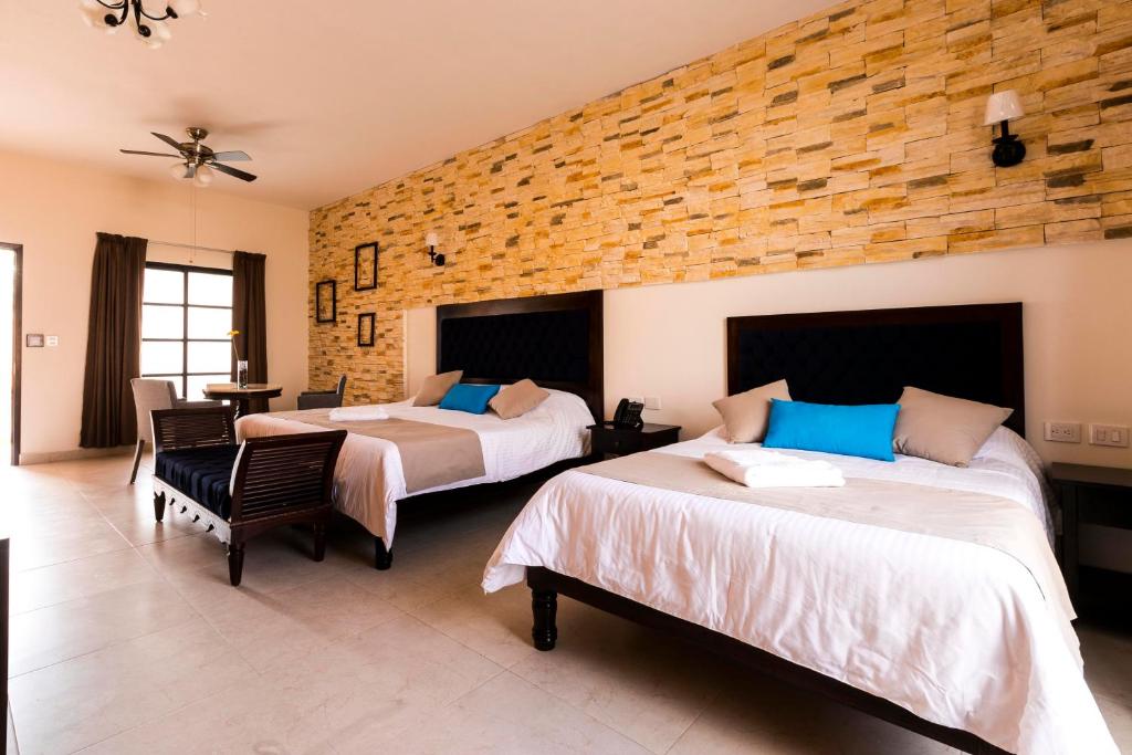 Postel nebo postele na pokoji v ubytování Hotel Los Frailes, Valladolid, Yucatán