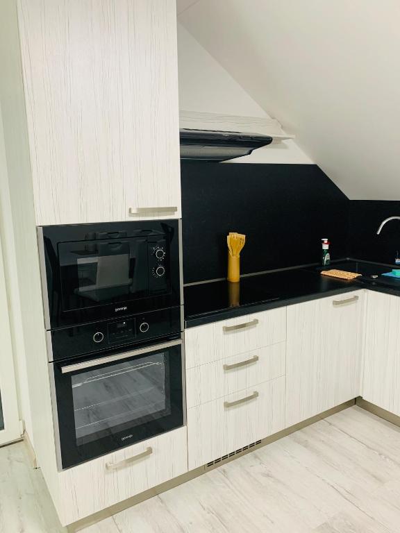 A kitchen or kitchenette at Apartmán Paseky