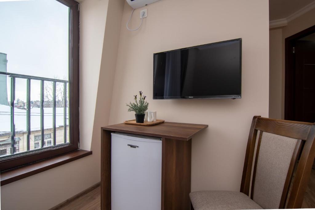 TV a/nebo společenská místnost v ubytování The Grand Piano Villa
