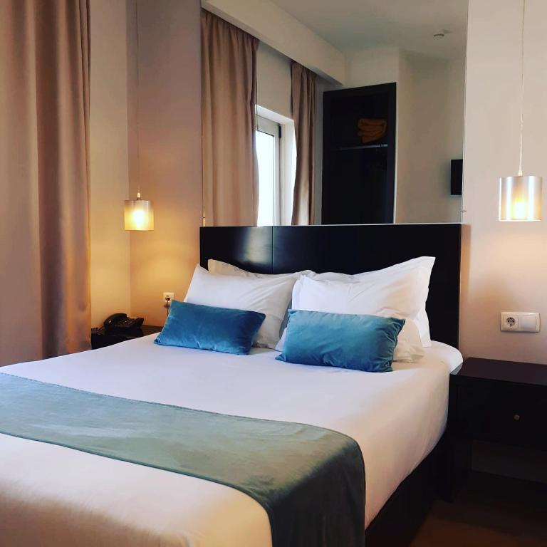 A bed or beds in a room at Lisbon City Hotel by City Hotels