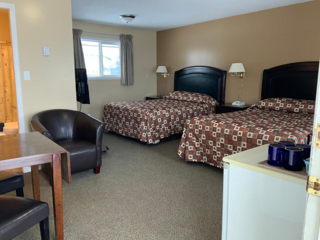 Postel nebo postele na pokoji v ubytování Monte Carlo Motel