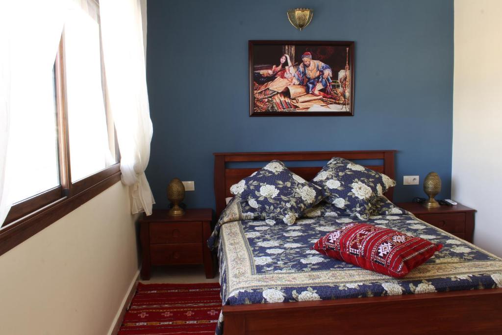 Postel nebo postele na pokoji v ubytování Riad Mimosa