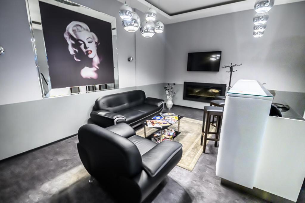 TV a/nebo společenská místnost v ubytování Hotel Luna