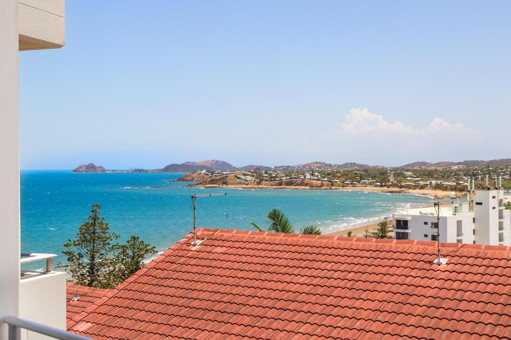 a view of the beach from the roof of a building at Ocean Views in Yeppoon