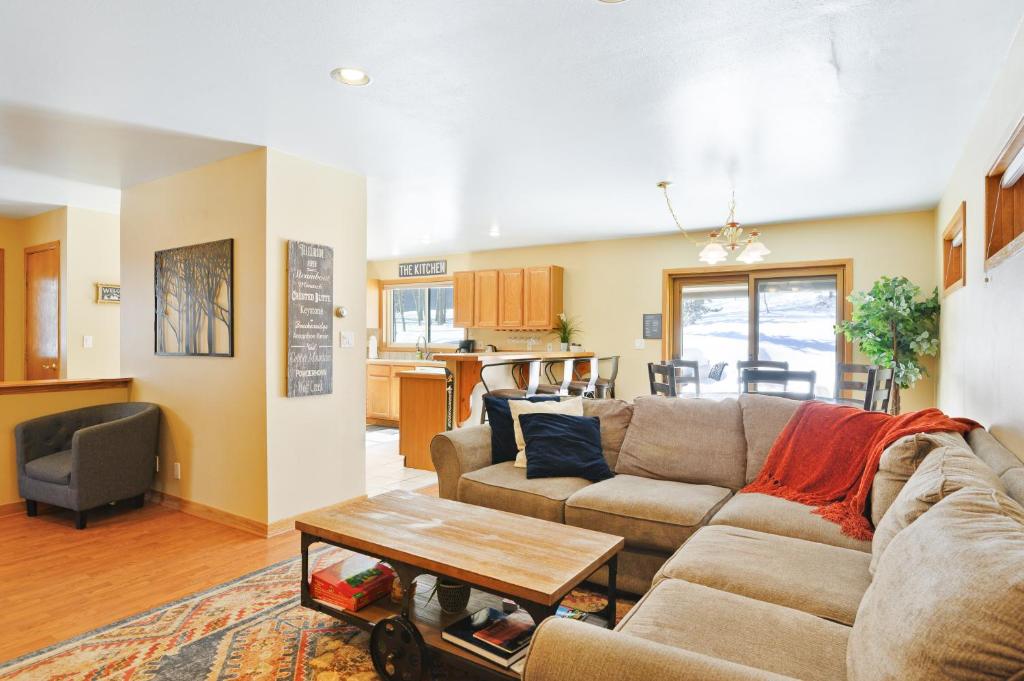 a living room with a couch and a table at Twenty Grand Chalet in Silverthorne