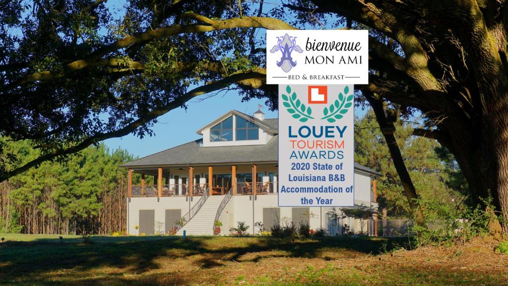 a house with a sign in front of it at Bienvenue Mon Ami Bed and Breakfast in Amite