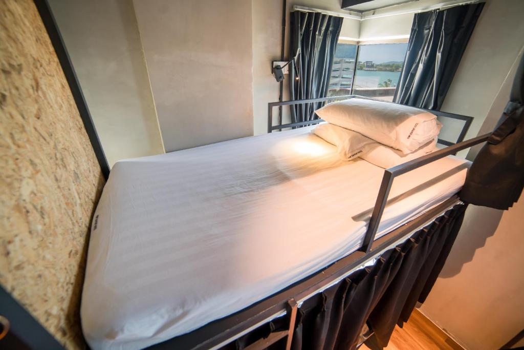 Postel nebo postele na pokoji v ubytování Homy Seafront Hostel