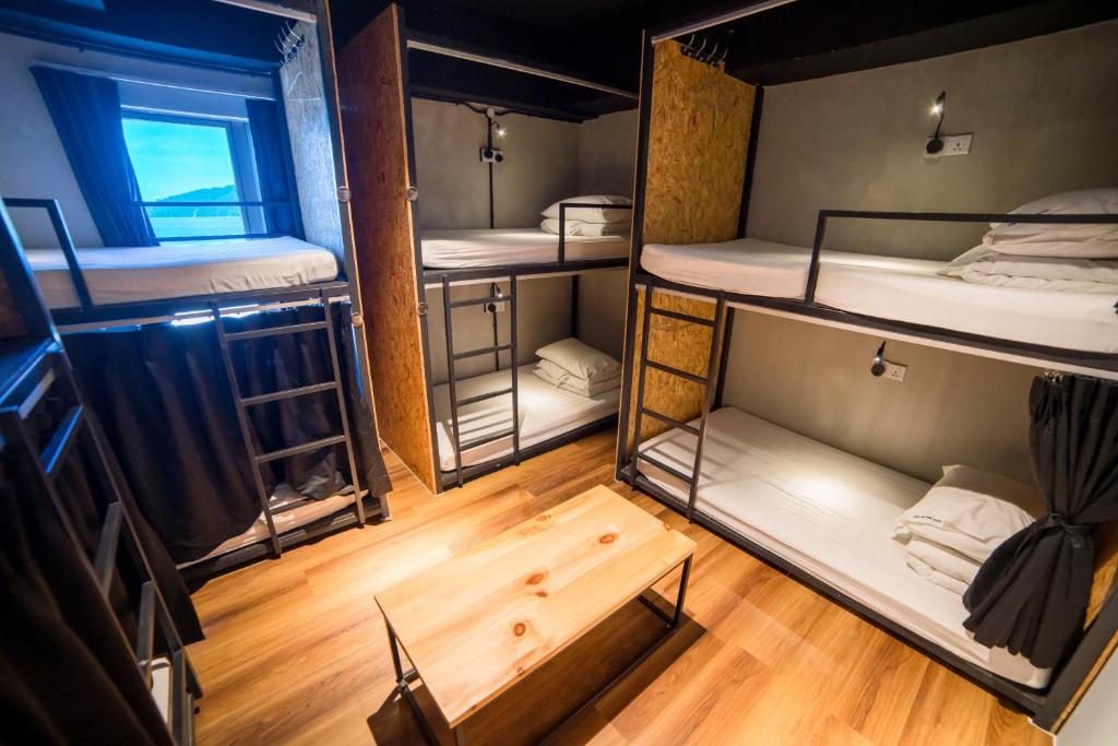 Postel nebo postele na pokoji v ubytování Homy Seafront Hostel