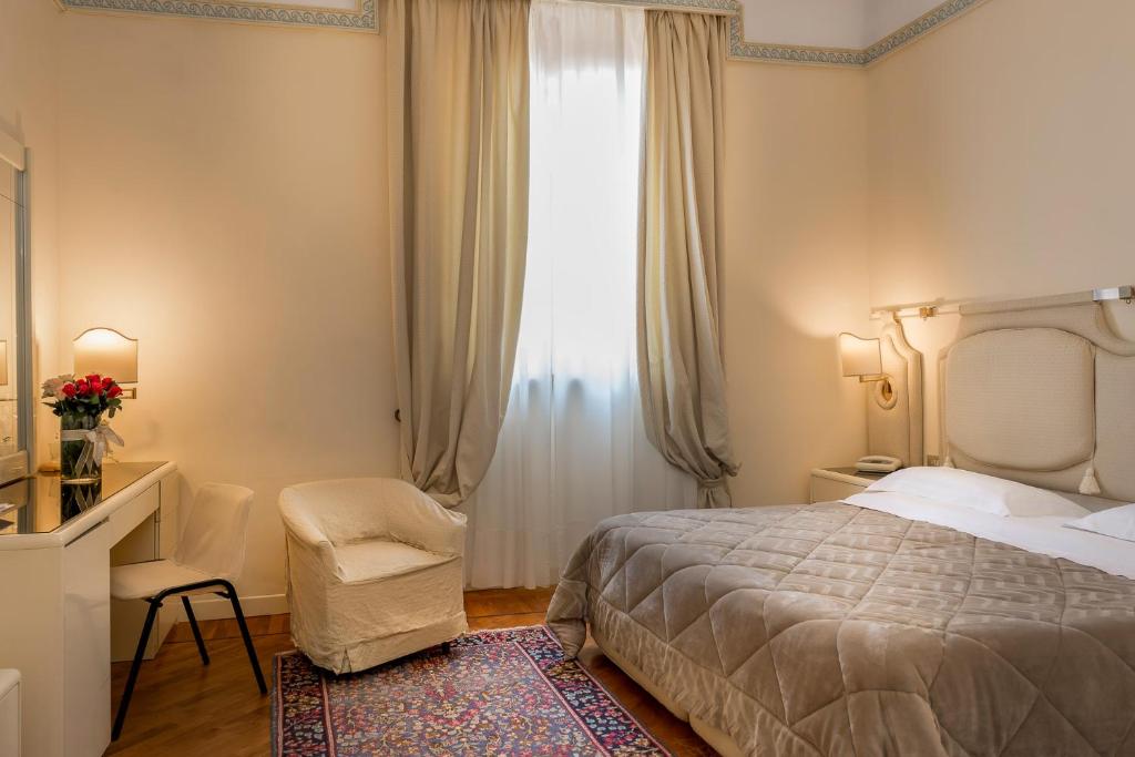 Postel nebo postele na pokoji v ubytování Grand Hotel Tettuccio