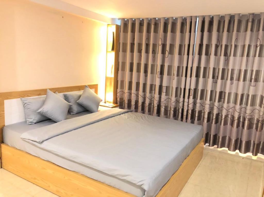 Postel nebo postele na pokoji v ubytování TrangTien Hostel