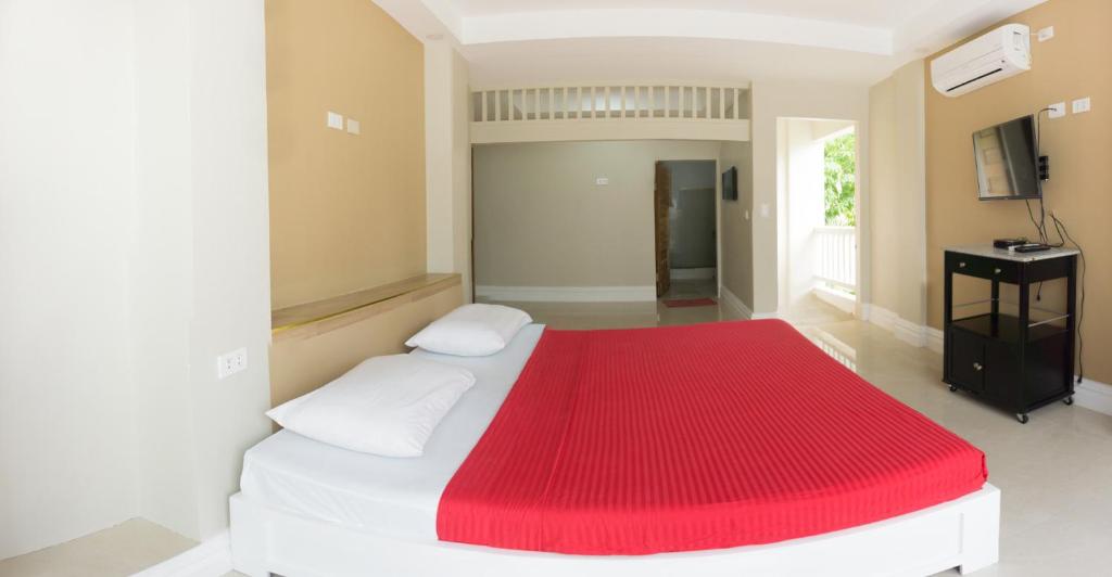 Postel nebo postele na pokoji v ubytování Sandscape Hotel