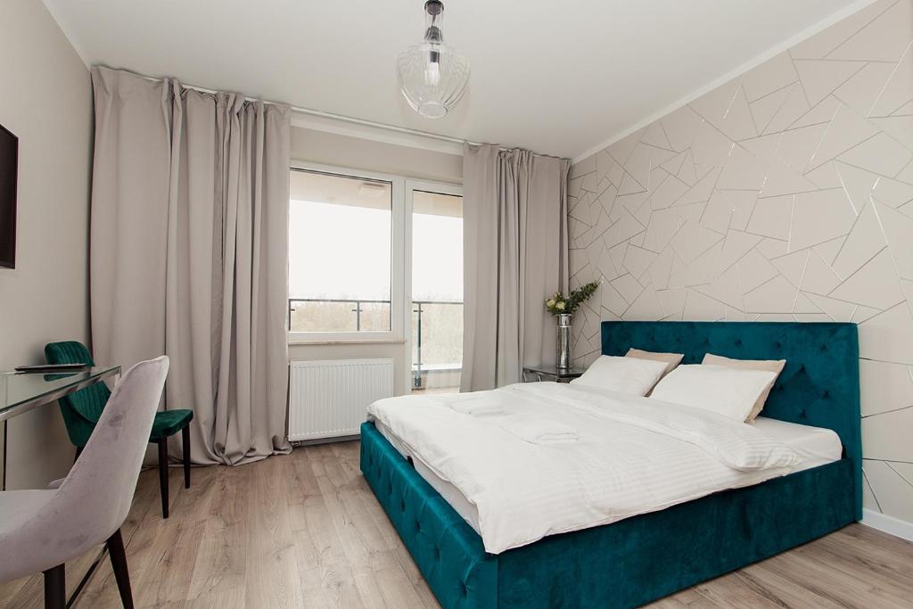 Warsaw To Be - Silver Apartment tesisinde bir odada yatak veya yataklar