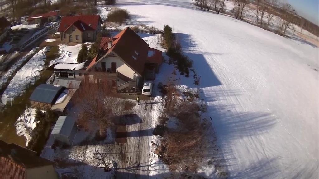 an aerial view of a house in the snow at Pokój na Mazurach in Węgorzewo