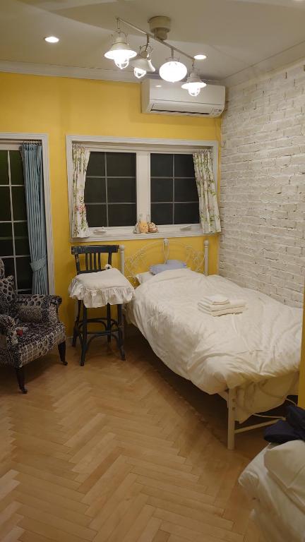 Una cama o camas en una habitación de ホテル The Standard Apartment Shibuya D 2020年オープン