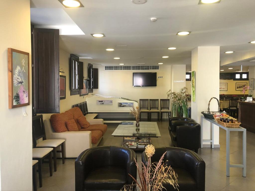TV a/nebo společenská místnost v ubytování Hotel Rural Real de Poqueira