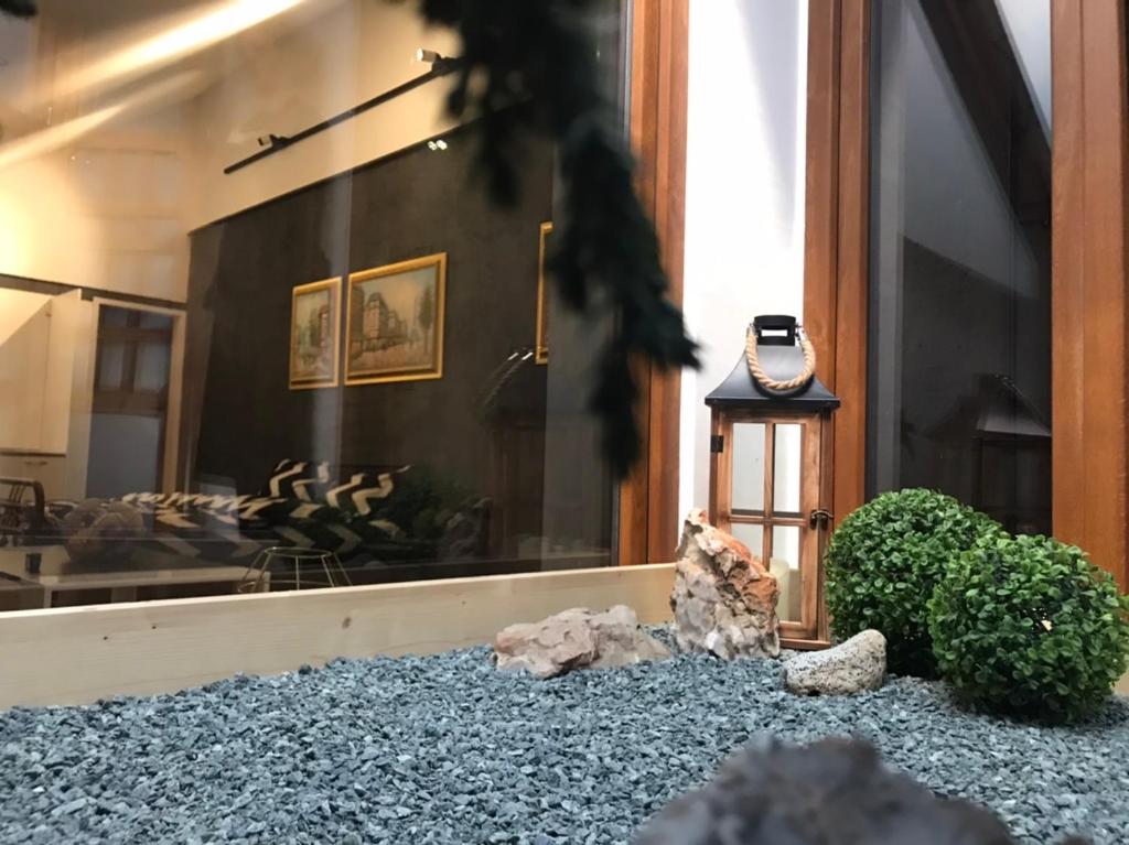 a room with a window with a clock on the ground at Savoya nr3 Studio Old City Center Self check-in in Timişoara