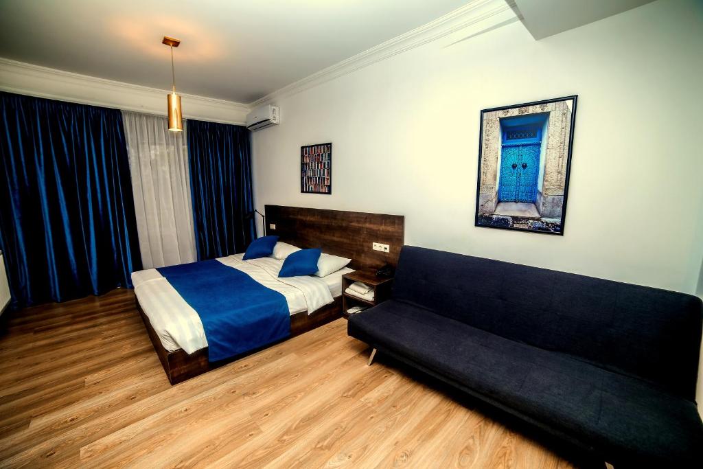 Postel nebo postele na pokoji v ubytování Tbilisi View Hotel