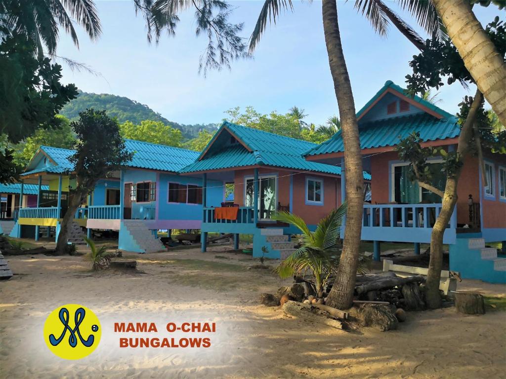 a house in a resort with palm trees at Mama O Chai Koh Tao in Koh Tao
