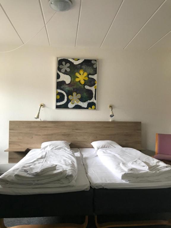 Postel nebo postele na pokoji v ubytování Hotel Medio Fredericia