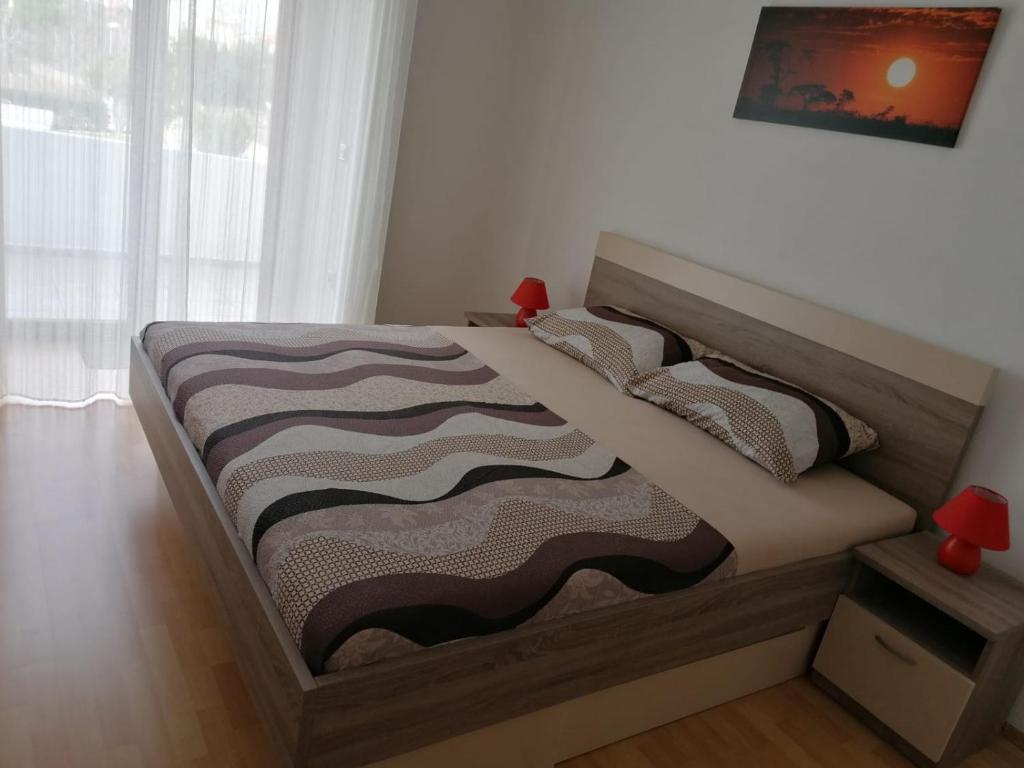 Posteľ alebo postele v izbe v ubytovaní Apartment Niva