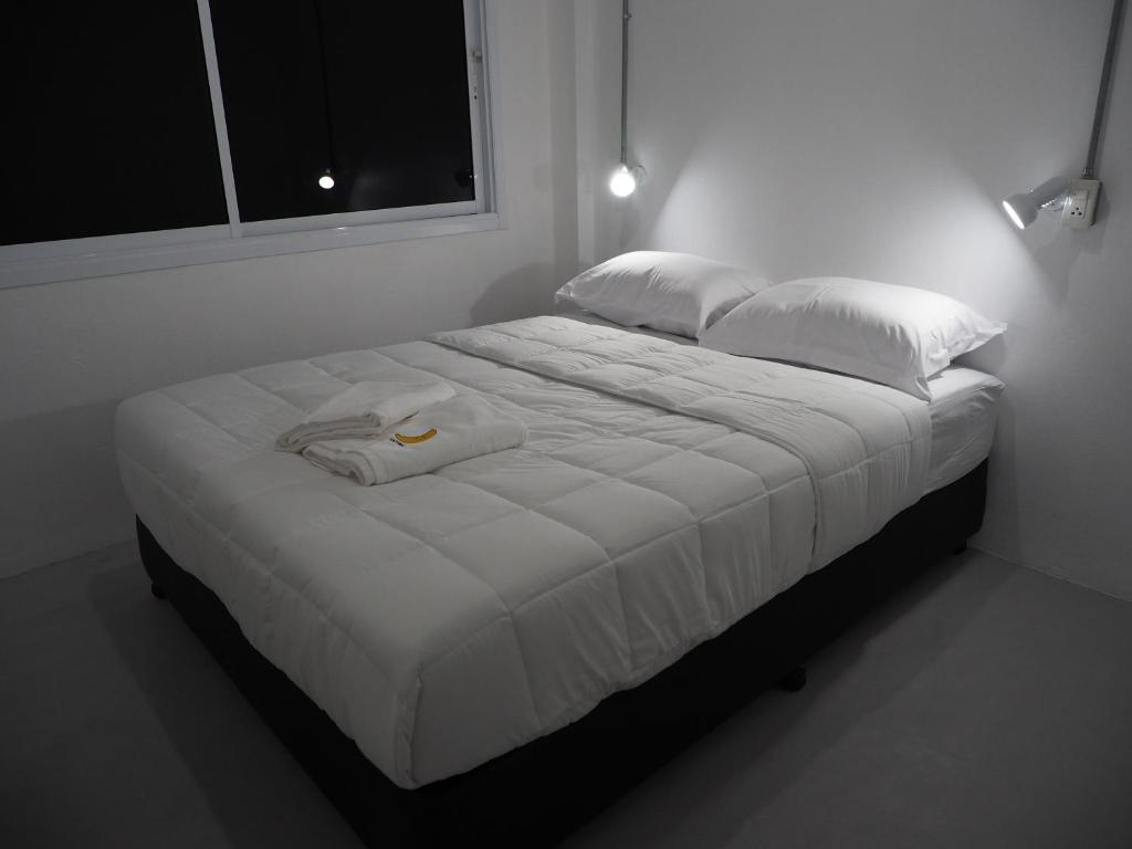 Postel nebo postele na pokoji v ubytování Prachan Hostel