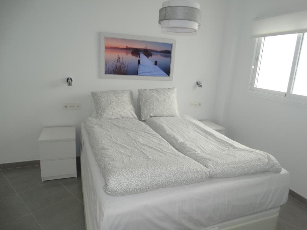 Posteľ alebo postele v izbe v ubytovaní Málaga Apartamentos - Jinetes, 23