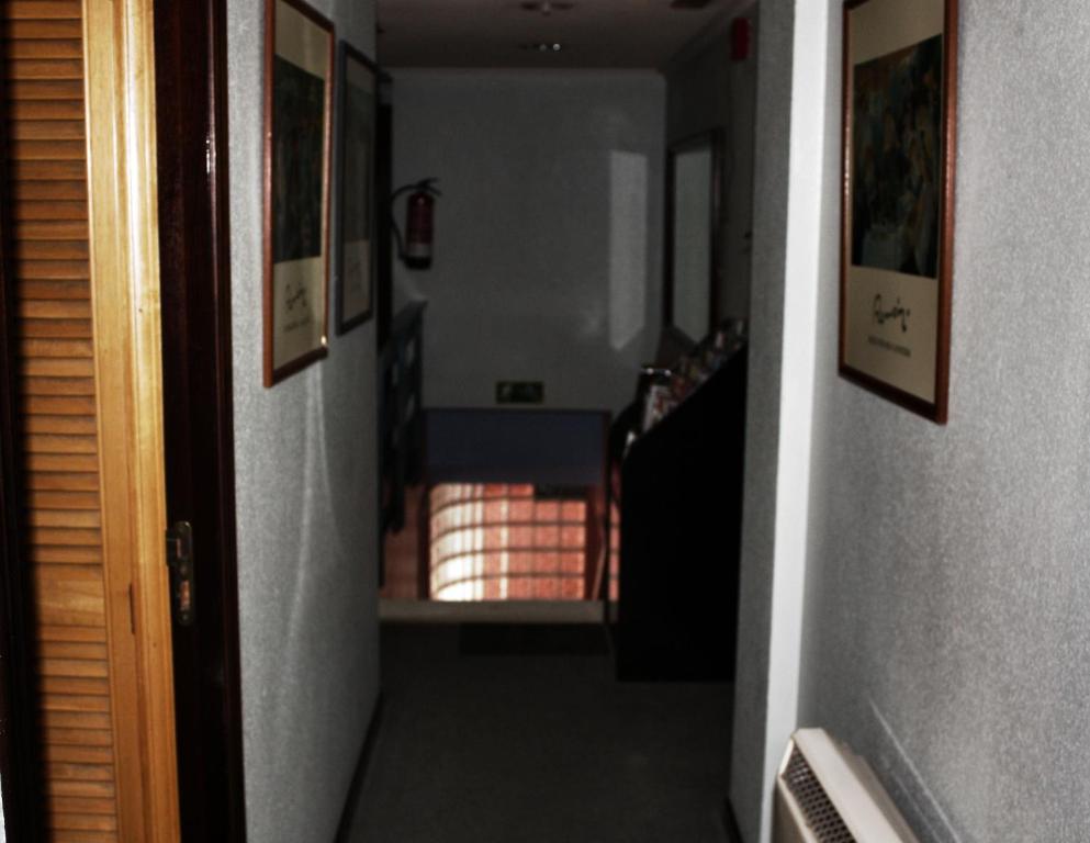 Postel nebo postele na pokoji v ubytování Alojamientos ALBOR I