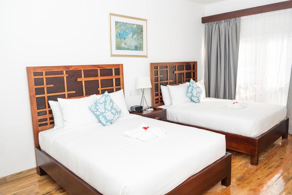 Postel nebo postele na pokoji v ubytování La Placita Inn