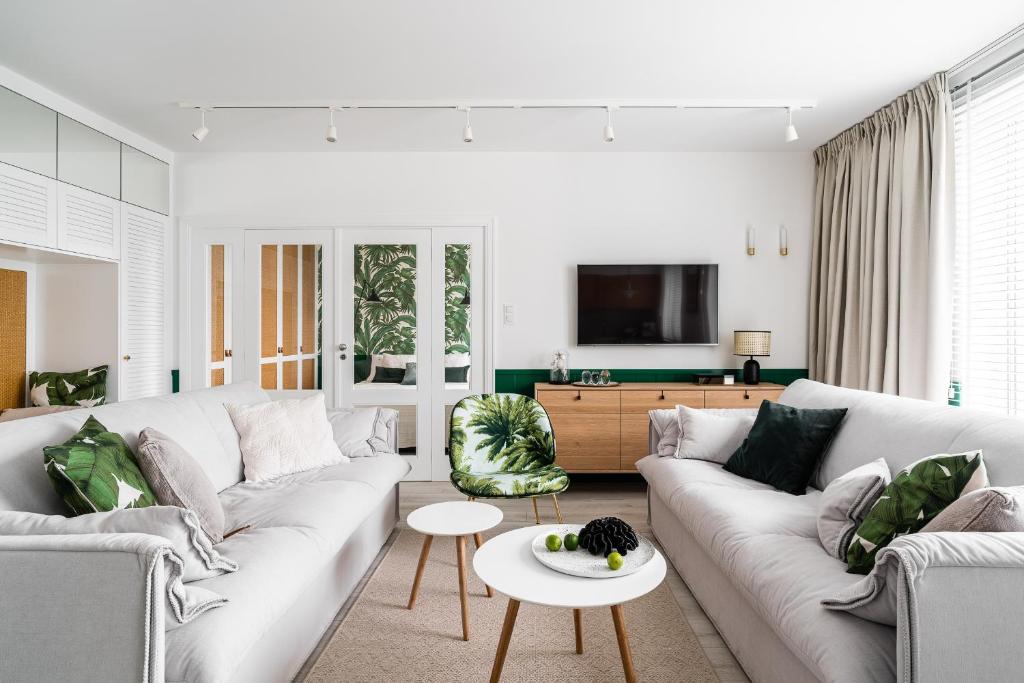 Televízia a/alebo spoločenská miestnosť v ubytovaní Apartament Ap175