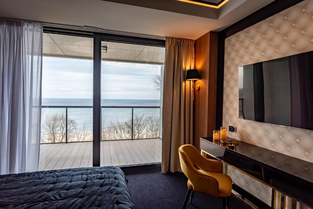Televízia a/alebo spoločenská miestnosť v ubytovaní Golden Eye Apartament Seaside Park