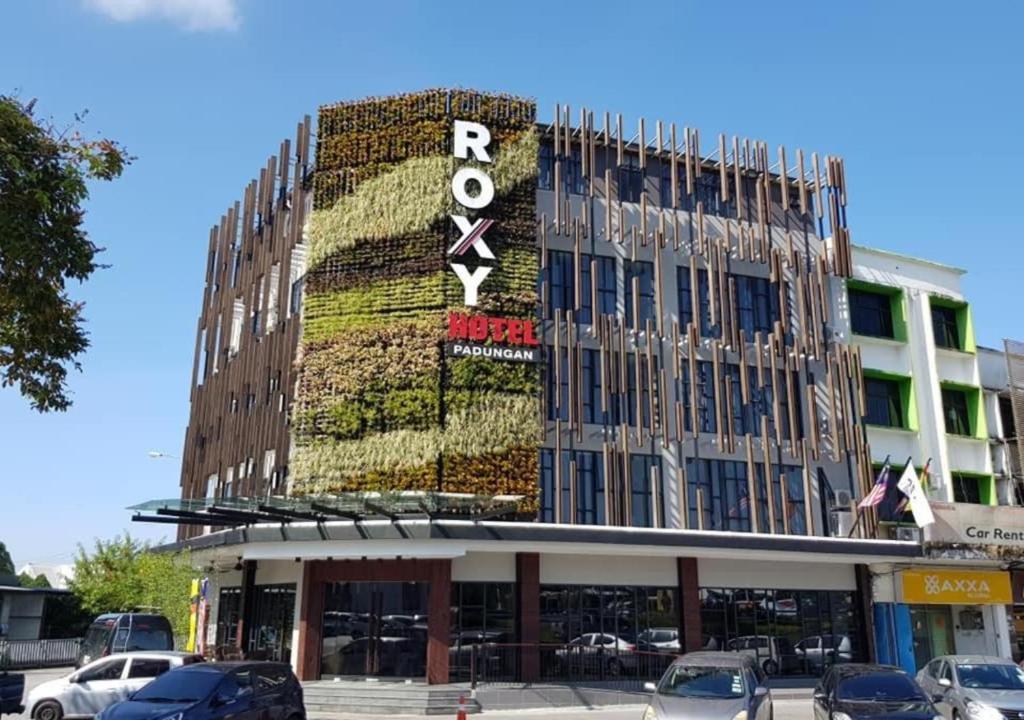 a building with a sign on the front of it at Roxy Hotel Padungan in Kuching