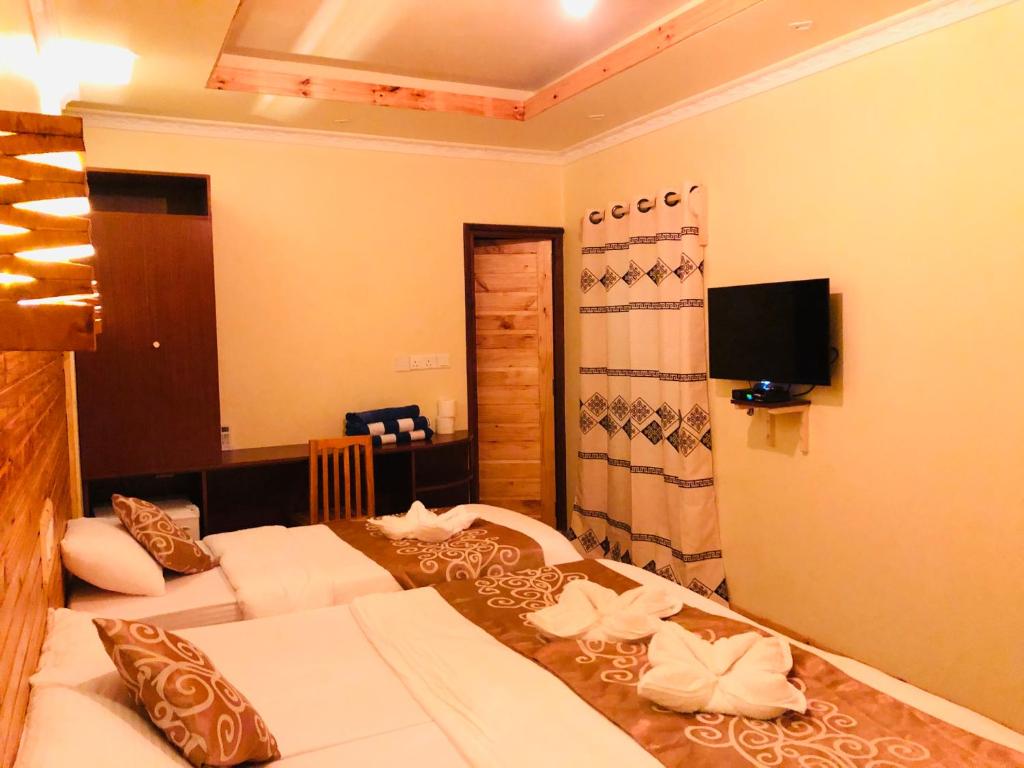 Postel nebo postele na pokoji v ubytování Mariana Maldives