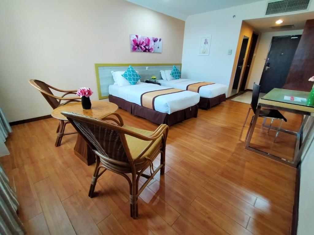 Postel nebo postele na pokoji v ubytování TD Plaza Hotel