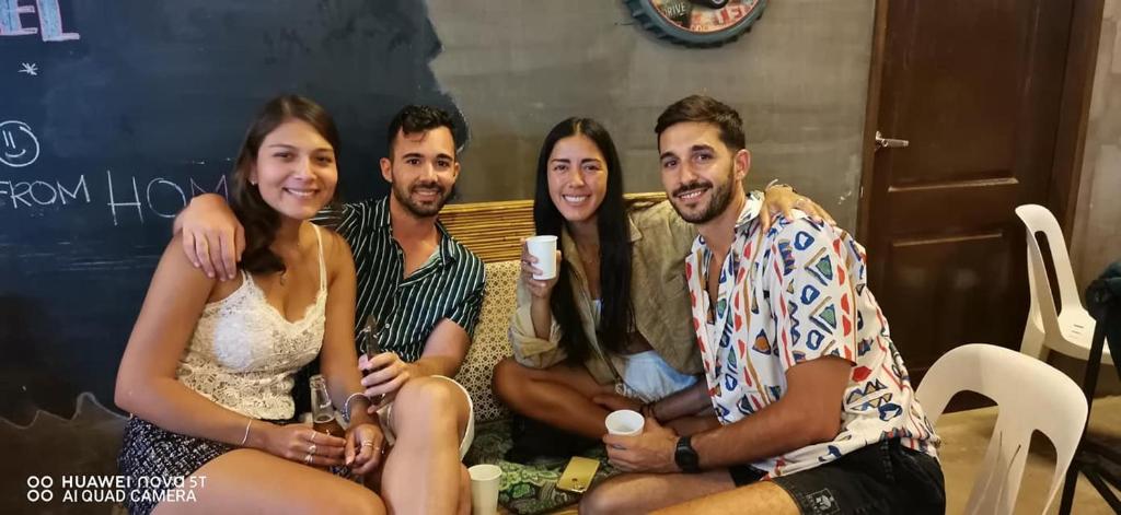 a group of people sitting on a couch at Big Paul Hostel in El Nido
