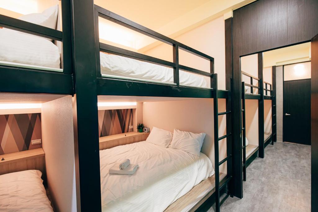 Postel nebo postele na pokoji v ubytování BIRD series B&B&Hostel複合式民宿#本國旅客須先匯款