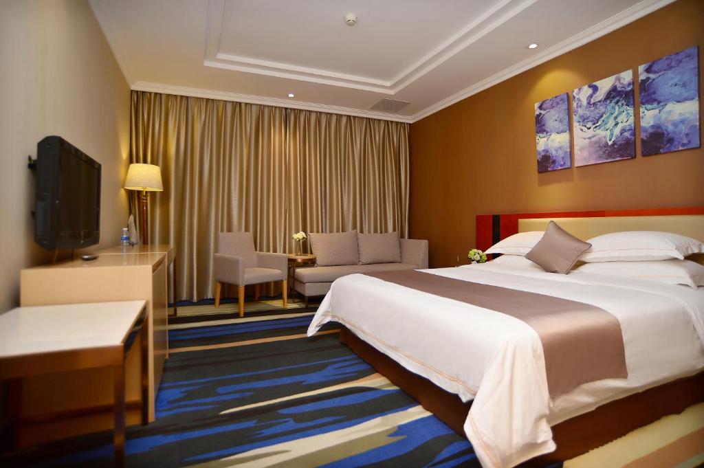 Postel nebo postele na pokoji v ubytování Shenzhen Kaili Hotel, Guomao Shopping Mall