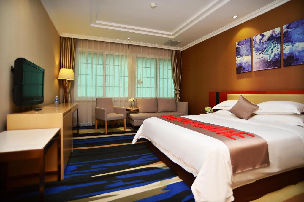 Postel nebo postele na pokoji v ubytování Shenzhen Kaili Hotel, Guomao Shopping Mall