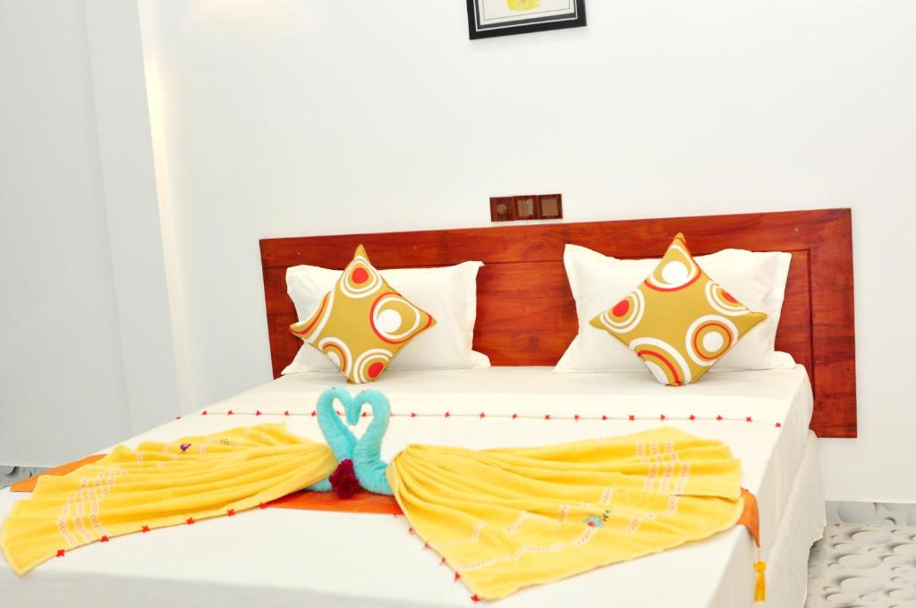 Postel nebo postele na pokoji v ubytování Sea View Villa Bentota, Induruwa