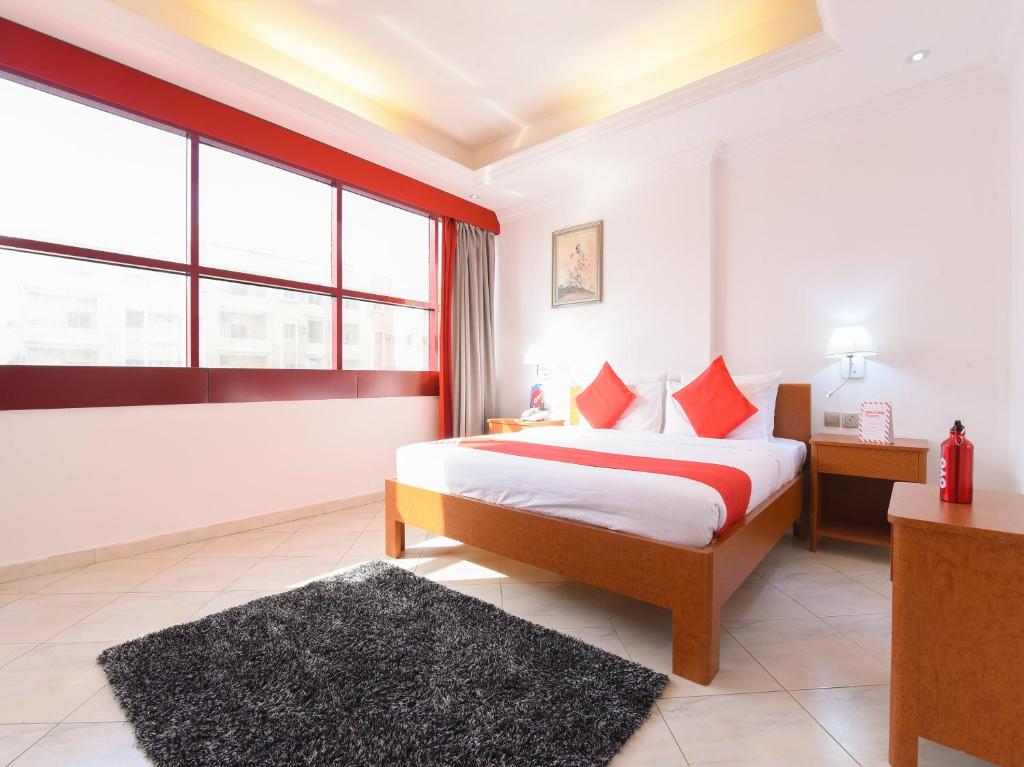 Postel nebo postele na pokoji v ubytování Mirage Hotel