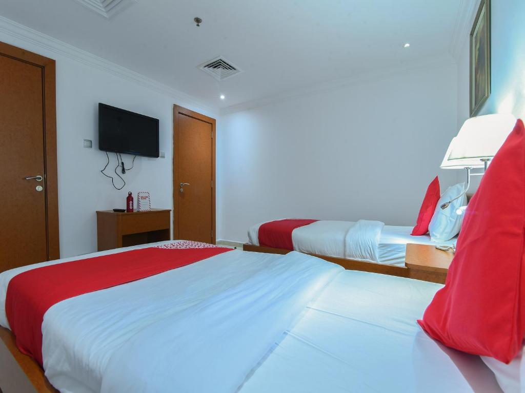 Postel nebo postele na pokoji v ubytování Mirage Hotel
