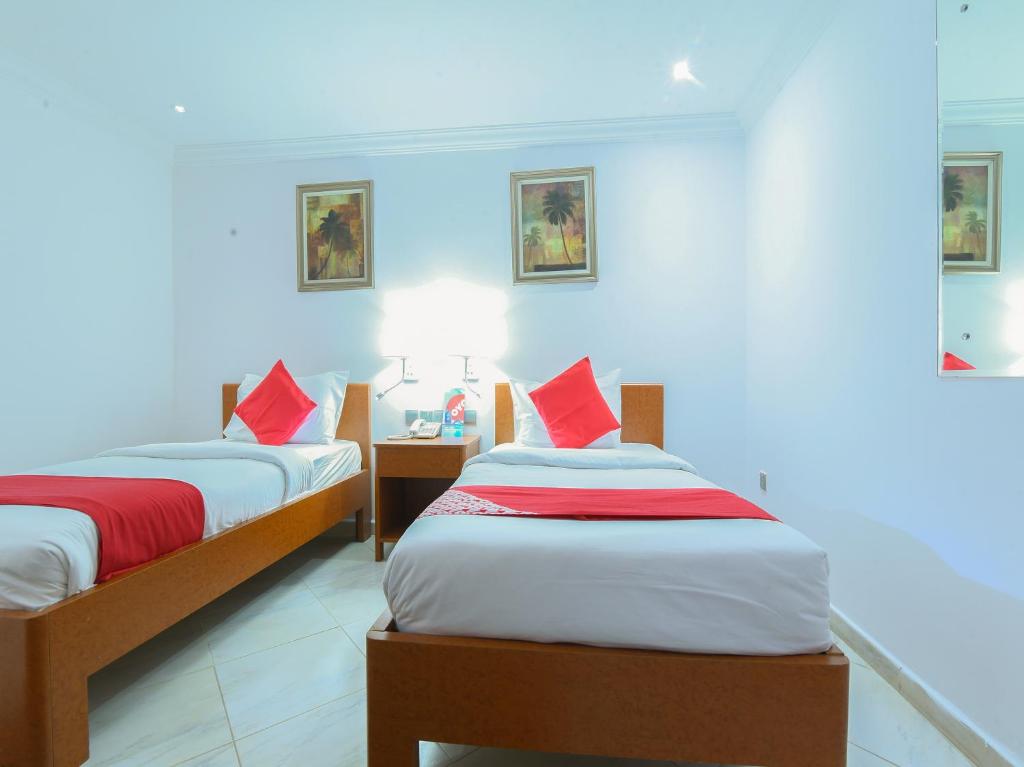 Postel nebo postele na pokoji v ubytování Mirage Hotel